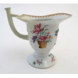 A late 18th / early 19thC Chinese export helmet jug with hand painted floral and cipher monogram