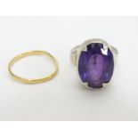 A hallmarked silver ring set with facet cut amethyst. Ring size approx O together with a gold