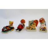 Four Goebel Redhead figures by Charlot Byj, comprising Lazy Day, a red haired boy fishing in a boat,