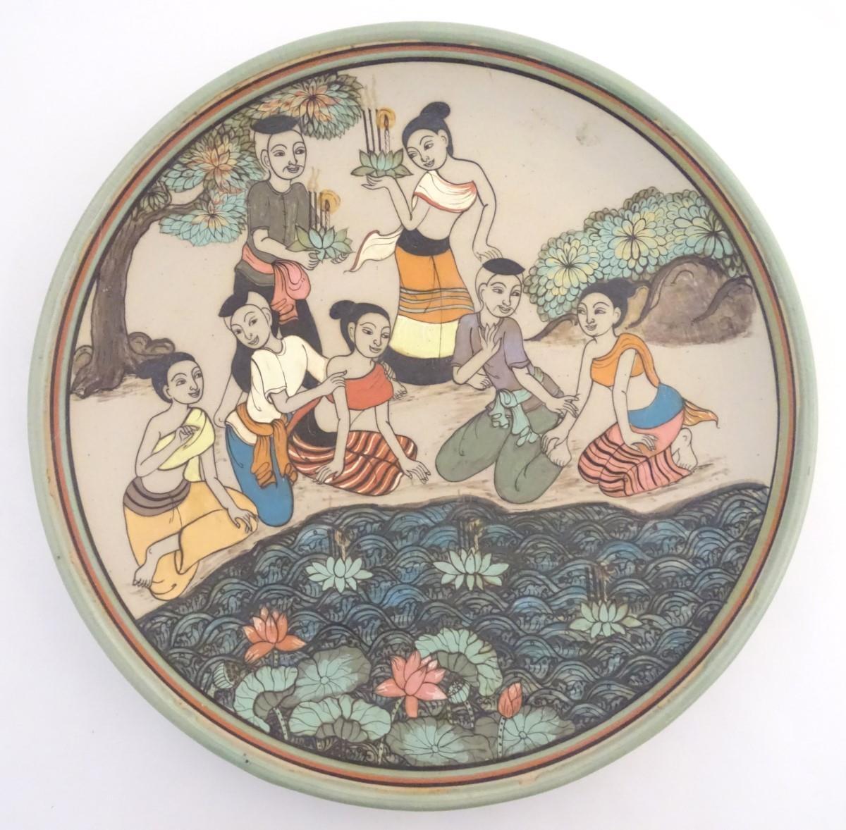 An Oriental plate, the unglazed centre decorated with a group of people in a landscape relaxing near - Image 4 of 8