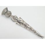 A Scottish silver kilt pin / brooch in the form of a dirk with thistle pommel Hallmarked Glasgow