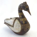 A 20thC ornamental wooden duck with antique brass decoration to the head and neck and mother of