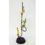 A bronze and coloured enamel sculpture of three acrobats on a rope. Approx. 41? high overall, the