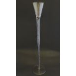 An early 19thC novelty wine glass, with oversized air twist inclusions of four spirals, the cup with