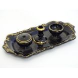 A Victorian ceramic standish / inkwell of lobed oblong form with scrolling foliate detail and gilt