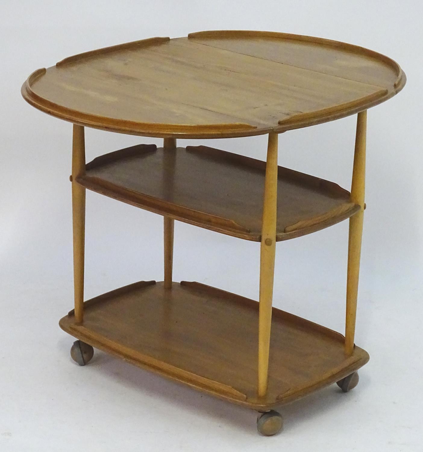 Vintage Retro, Mid-Century: an Ercol elm and beech three tiered trolley, the top with drop flaps, - Image 4 of 5