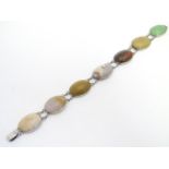 A Continental . 800 silver bracelet set with various agate hardstone cabochon. Approx 7" long Please