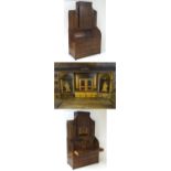 A 19thC mahogany three part bookcase with a rolling cylindrical front opening to show a fitted