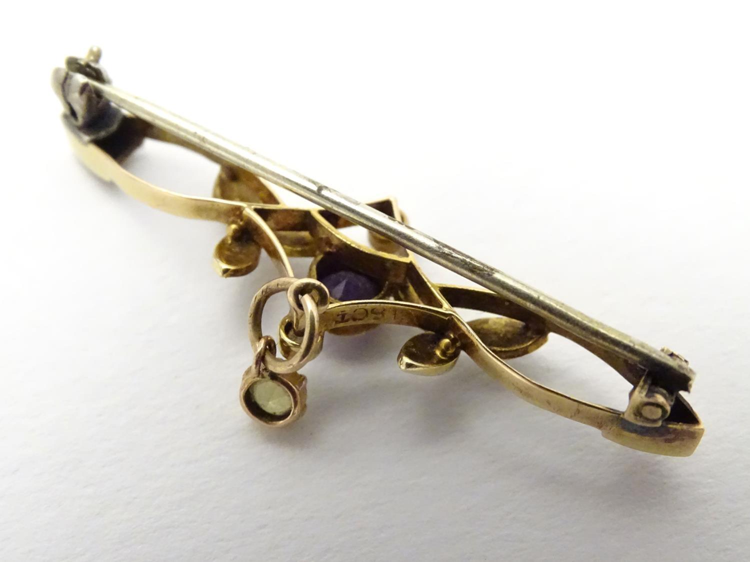 Suffragette jewellery : An early 20thC 15ct gold brooch set with amethyst, seed pearls and peridot ( - Image 5 of 5