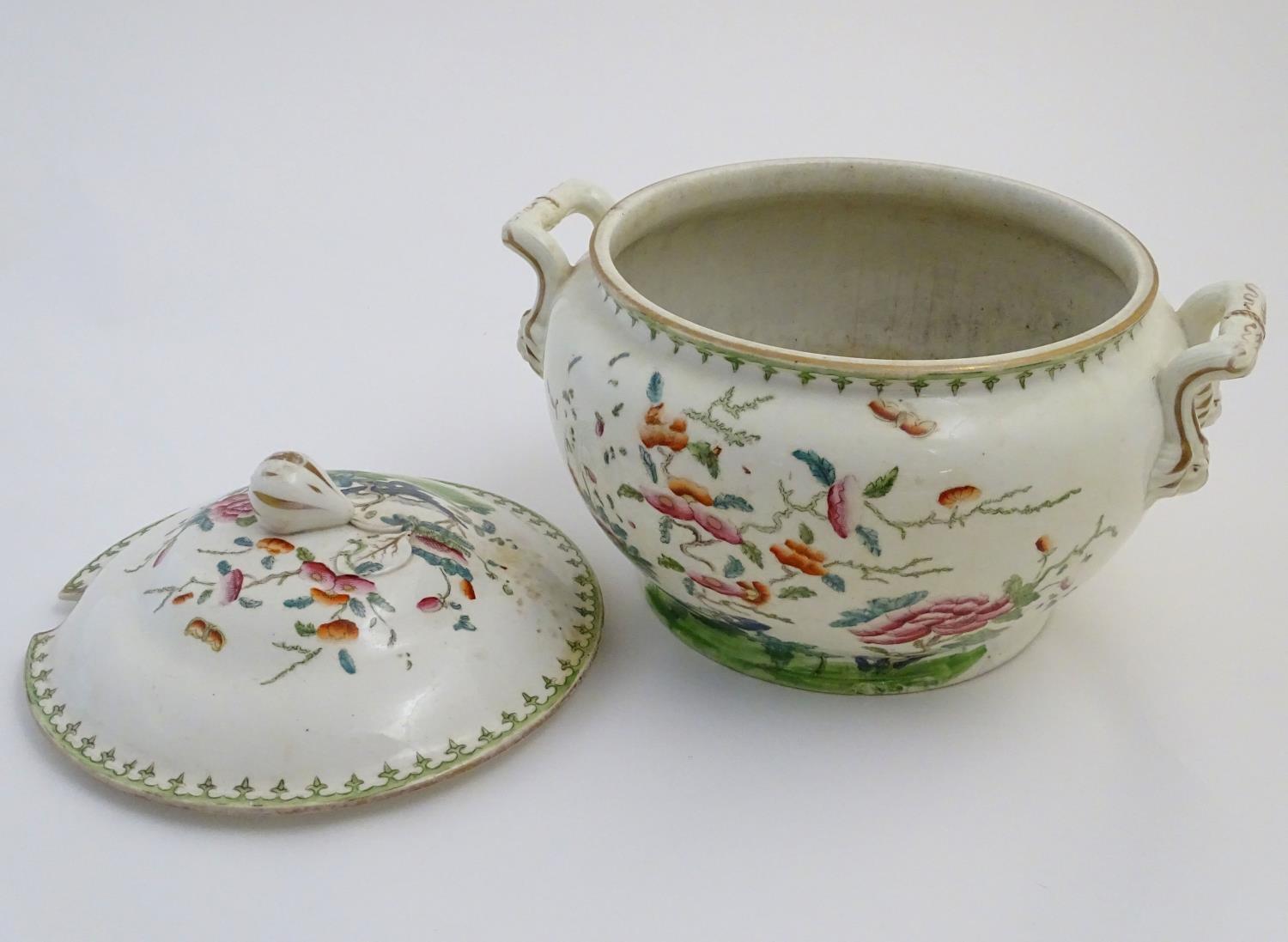 A Chinese tureen and cover with twin handles decorated with a stylised landscape with a tree and - Image 6 of 10