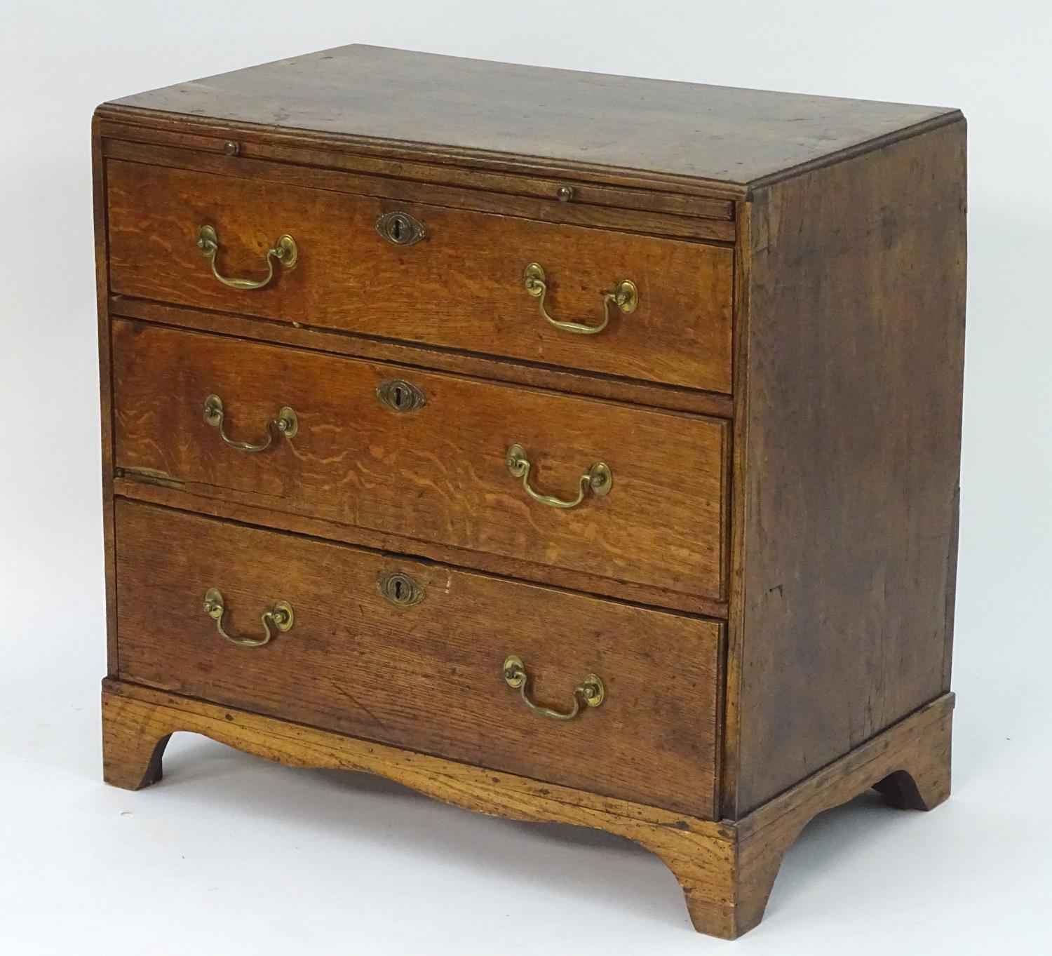 A mid 18thC oak chest of drawers with a rectangular top above a brushing slide and three long - Image 3 of 7