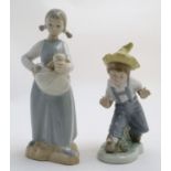 Two Nao figures with animals, A girl with kittens in her apron and a boy with birds, Little