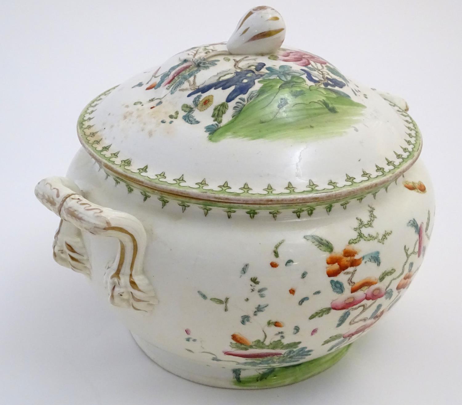 A Chinese tureen and cover with twin handles decorated with a stylised landscape with a tree and - Image 3 of 10