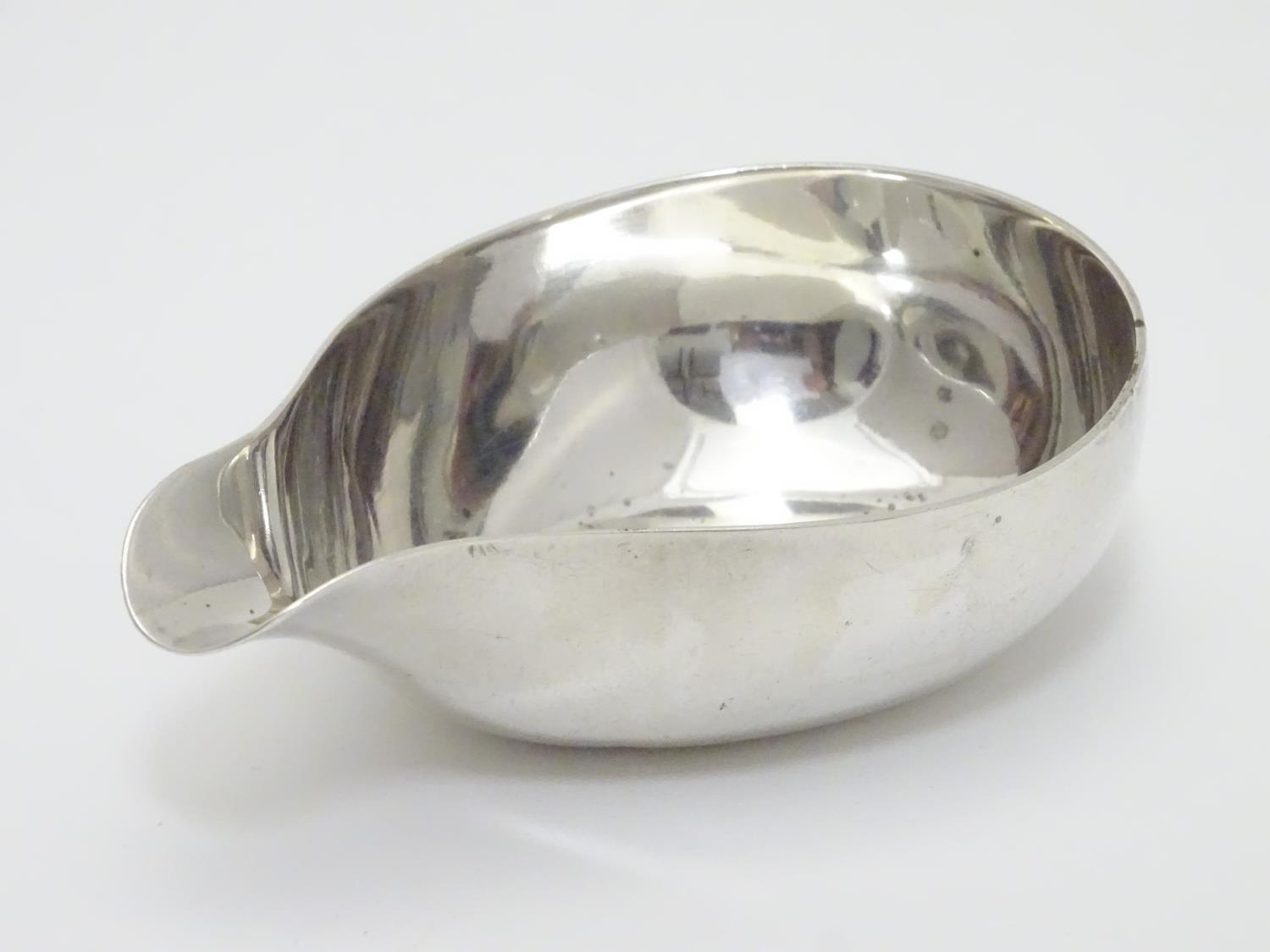 A Geo III silver pap boat hallmarked London c. 1763 maker W.H ? Approx 4 1/4" long (60g) Please Note - Image 3 of 4