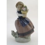 A Lladro figure of a girl with a flower pot, Spring is Here, model no. 5223. Approx. 7" high. Please