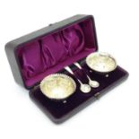 A cased pair of Victorian silver table salts hallmarked Birmingham 1895 maker J.G with associated