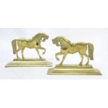 A pair of Victorian cast brass door stops formed as horses. Approx. 8 1/4" high x 12" long (2)