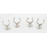 A set of 4 silver table place card holders in shape of stag/deer antlers. Hallmarked London 2001