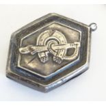 A Victorian silver pendant decorated with horse shoe, hoof and riding whip hallmarked Birmingham