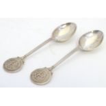 Two silver teaspoons marked to top HGC. Hallmarked Birmingham 1928/30 maker Bravingtons Ltd 4 1/2"