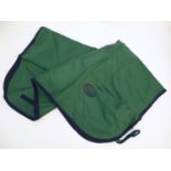 A waterproof horse exercise sheet in green and navy, approx. 4'3 Please Note - we do not make