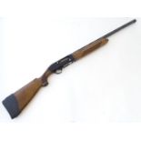 Shotgun: a Beretta 'A301' 12 gauge semi automatic shotgun, walnut pistol-grip stock (chequered) with