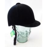 A Champion junior jockey helmet / horse riding hat in black (size 7.5), with tags Please Note - we