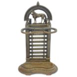 A late 19thC cast iron and brass stick stand, the guard formed as opposing horseshoes, the