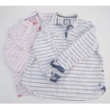 Two Joules Mariners Grade long sleeve polo shirts, one white with pink stripes, the other white with