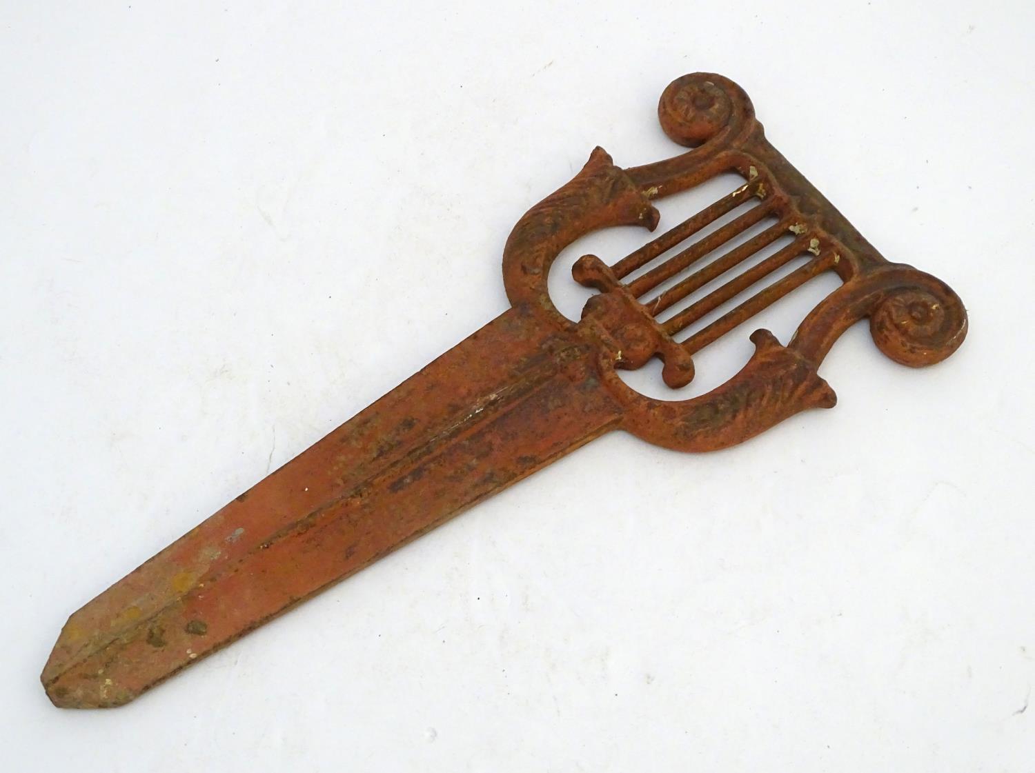 A Victorian cast iron bootscraper, formed as a lyre above a long blade mount, 19" long Please Note - - Image 3 of 3