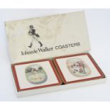 Johnnie Walker : A cased set of 6 drinks coasters depicting the whiskey advertising figure Johnnie