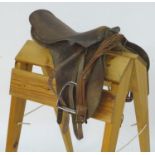 A brown leather horse riding / equestrian saddle with stirrups, Approx. 17 1/2" Please Note - we