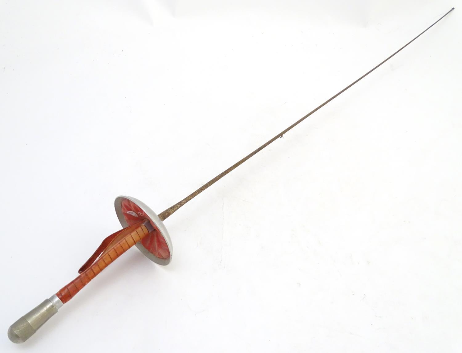 A Leon Paul fencing foil with a leather bound handle. Blade approx. 35" long Please Note - we do not