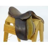 A Lemetex brown leather horse riding / equestrian saddle. Approx. 17" Please Note - we do not make