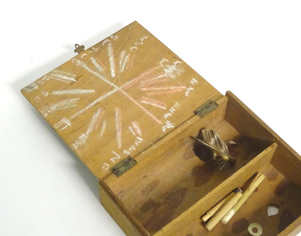 A box of vintage darts some with feather flights contained within a wooden box. Approx. 7 pieces. - Image 4 of 5