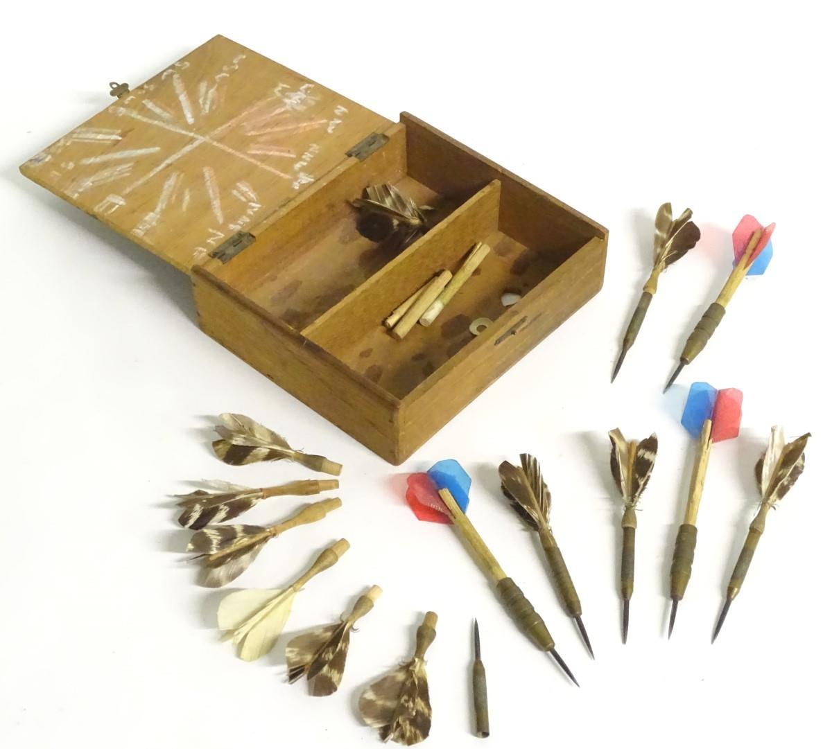 A box of vintage darts some with feather flights contained within a wooden box. Approx. 7 pieces. - Image 2 of 5