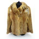 A vintage short length fur coat, approx. UK size 8 - 10 Please Note - we do not make reference to