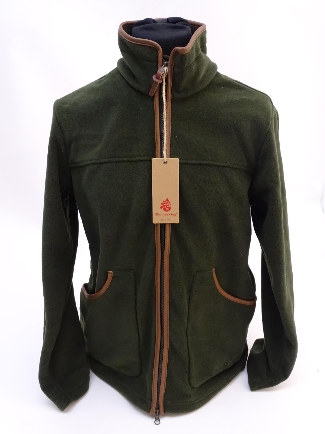 A Shooter King green fleece, size L, with tags. Please Note - we do not make reference to the