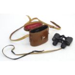 A pair of 'Imperator' 8x26 binoculars / field glasses, in a fitted leather case marked Sir John