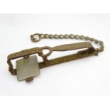 Antique trap: an early 20thC gin trap, 11" long, with securing chain Please Note - we do not make