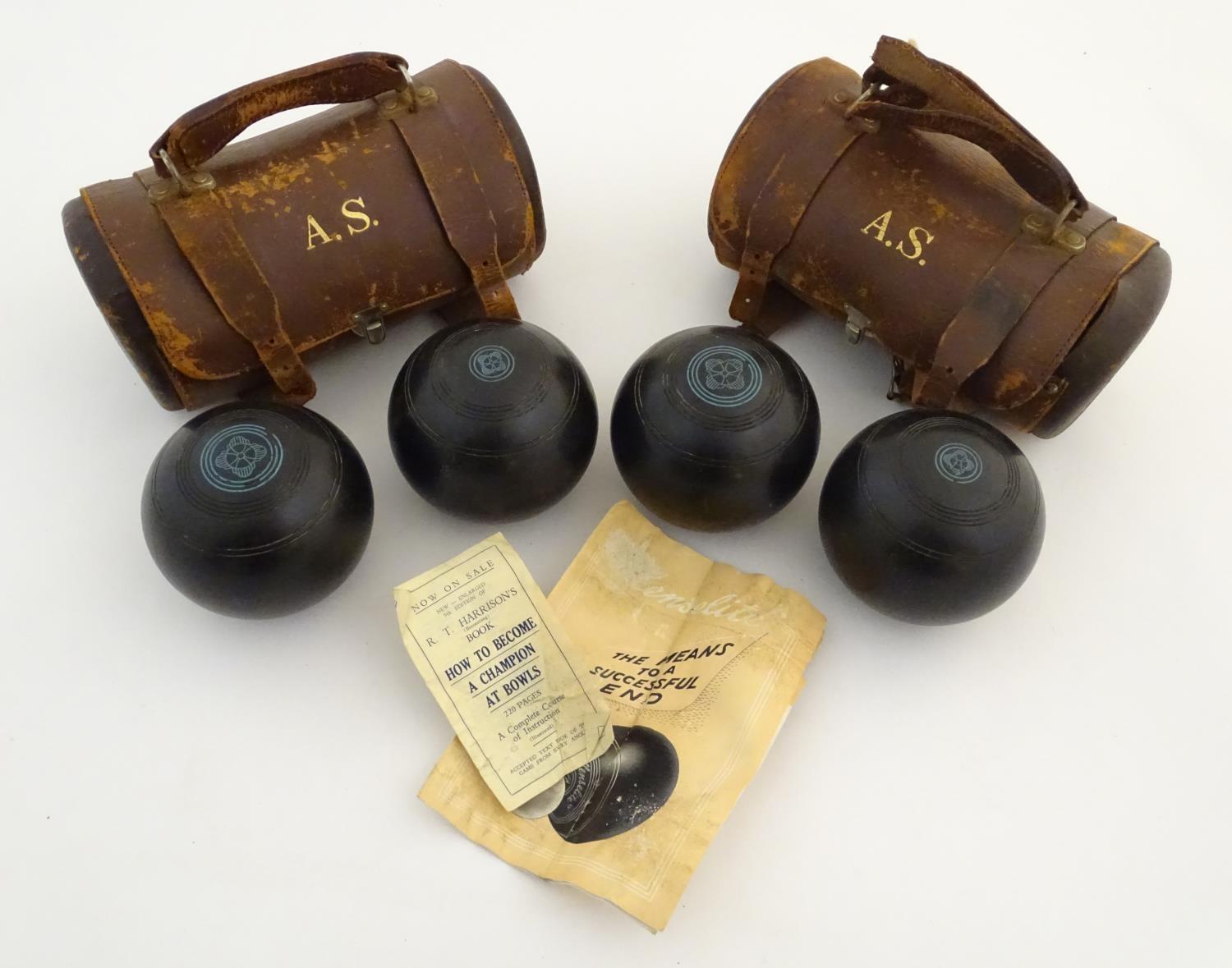 Two pairs of Henselite standard lawn bowls, South African Model. Each pair contained within a