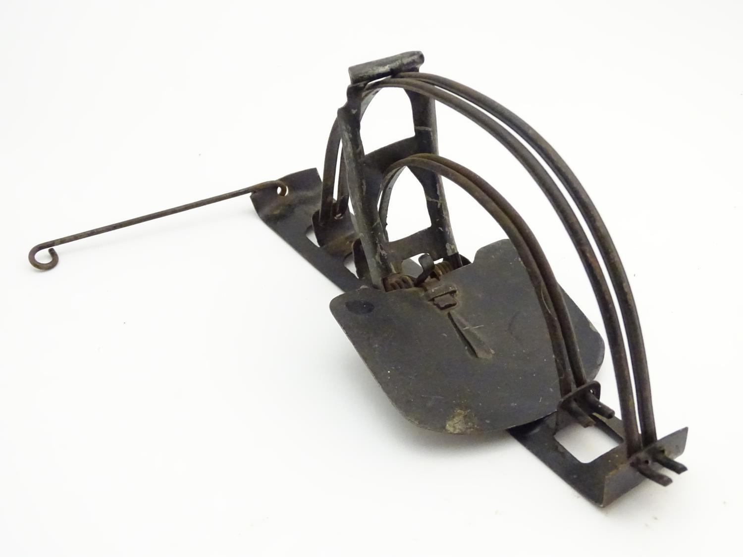 Antique trap: a mid-20thC tin pole rat trap, 9" long Please Note - we do not make reference to the
