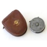 A vintage Allcocks 'Marvel' centrepin fly reel, within a J.W. Young leather case, 3 1/2" in diameter