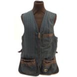A Top Gun Ltd. navy skeet vest, size XL Please Note - we do not make reference to the condition of