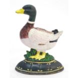 A cast door stop / door porter formed as a duck with painted decoration. Approx. 7 1/4" high