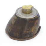 An inkwell formed from a horse hoof and having a brass lid to inkwell engraved with Masonic