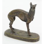 A late 19th / early 20thC cast model of a greyhound dog mounted on an oval base. Approx. 4 1/2" high