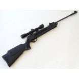 Airgun: an SMK 'Victory LB600' .22 break barrel air rifle, with silencer, black synthetic stock (