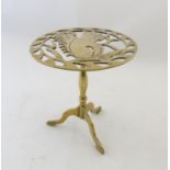 A Victorian brass trivet with pierced squirrel decoration and triform foot. 8" diameter x 8 1/2"