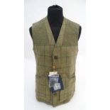 A Beretta tweed gilet, size 38, with tags Please Note - we do not make reference to the condition of